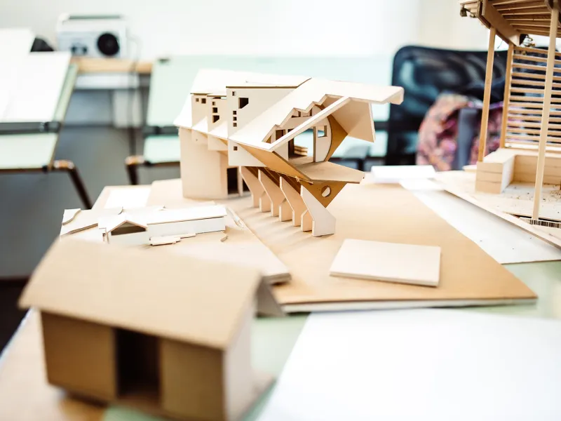 Tiny home models arrayed on a table