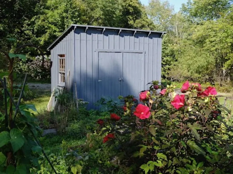 A Yestermorrow shed placed in a clients yard.