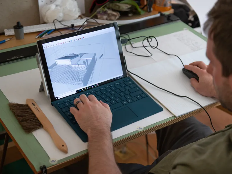 A student works on a sketchup design in the drafting studio