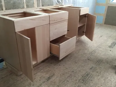 A completed set of student built kitchen cabinets.