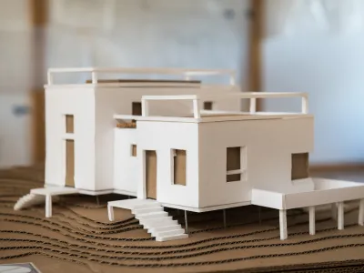A model of the bunkhouse is photographed in the studio