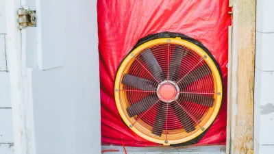 A blower door test in a door frame. 