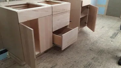 A completed set of student built kitchen cabinets.