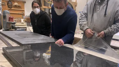 Students observe a concrete countertop being unpeeled