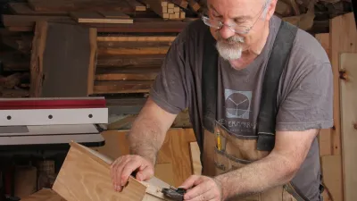 Ken Burton working wood in the woodshop