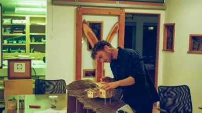 Philip works on a model in the main studio. 