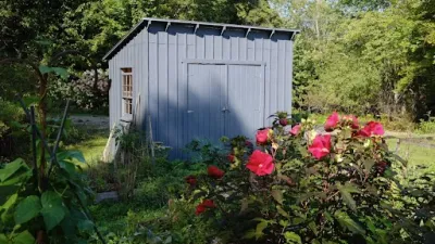 A Yestermorrow shed placed in a clients yard.
