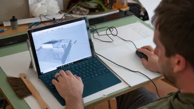 A student works on a sketchup design in the drafting studio