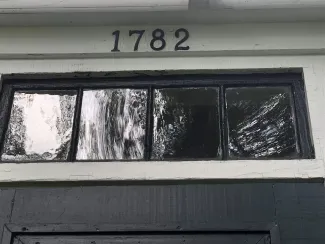 Image of a transom window with the year 1782 above
