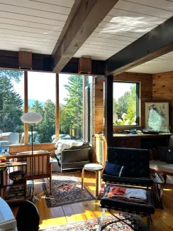 Interior shot of Britton's house, looking out the living room windows towards the ridgeline.