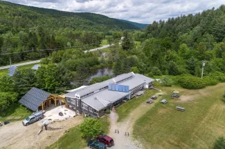 Aerial shot of the main building and parking lot looking north along the valley