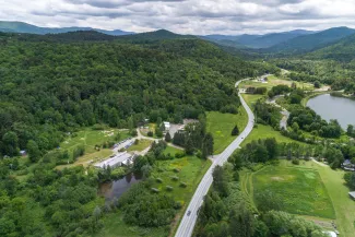 Aerial shot of the yestermorrow campus, Route 100, and the valley.