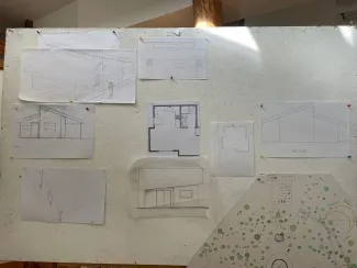 Photo of a whiteboard with architectural drawings in the studio