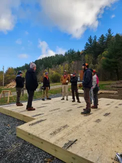 The semester group circles up in the morning on their floor deck