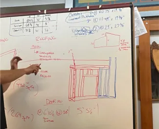 Photo of a whiteboard with bathroom layout diagrammed