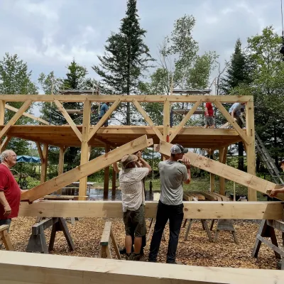 Students in a timber framing class assemble a truss.