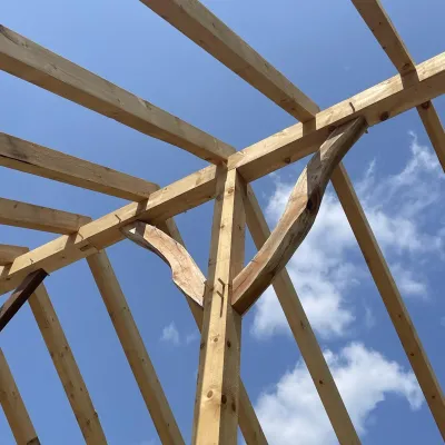 Detail shot of a timber frame bent and brace.