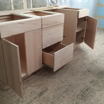 A completed set of student built kitchen cabinets.