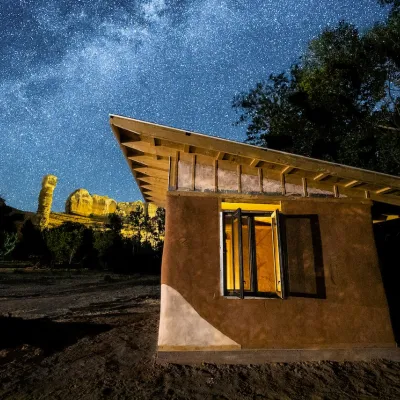 Bluff cabanita shot with bluff formations in the background at night with a starry sky