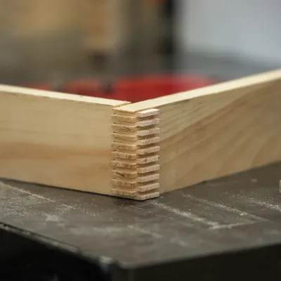 Detail shot of narrow finger joints on a corner of a box.