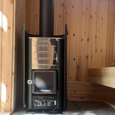 A Harvia woodstove installed in a sauna. 