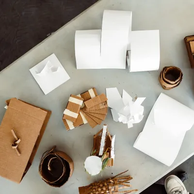 Cardboard models photographed from above on a table