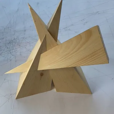 Three intersecting wooden pyramids,