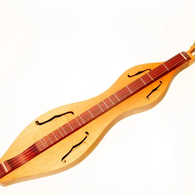 Wooden lap dulcimer pictured in photo studio